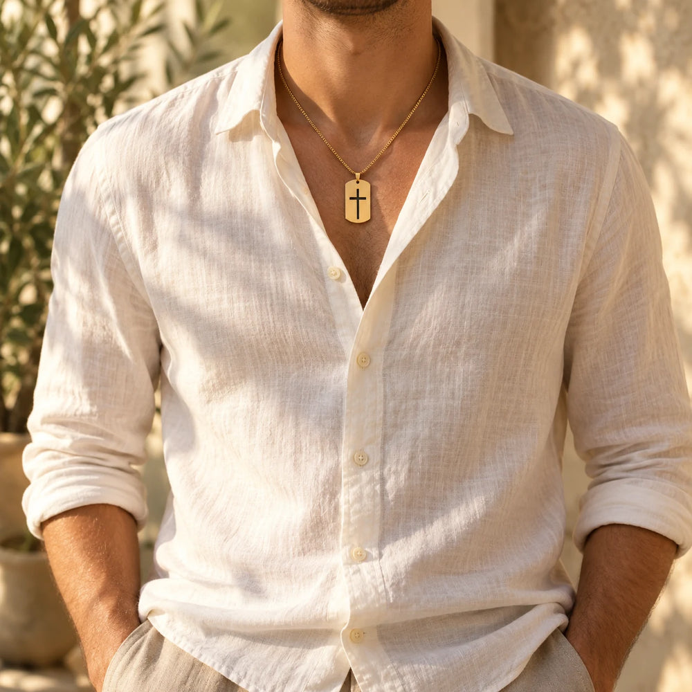 Silver-tone cross tag necklace worn by a man over a white t-shirt — true size: the tag is 40 mm tall and 24 mm wide (about 49 mm with the bail), on a box chain about 2.5–3 mm wide