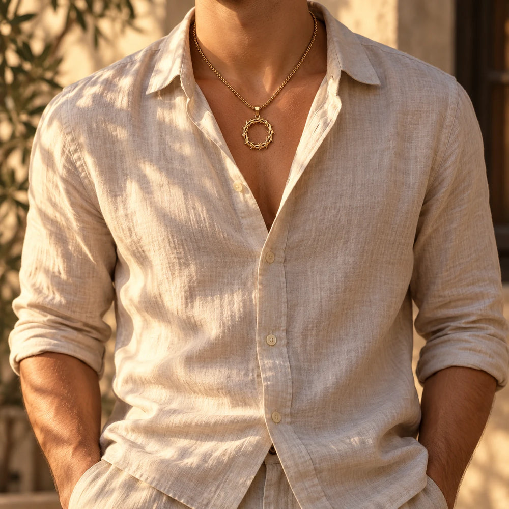 Silver-tone crown of thorns pendant on a rope chain worn over a cream cable-knit sweater — true size: the crown-of-thorns ring pendant is about 31 mm across and about 45 mm tall including its bail, on a rope chain about 3 mm thick