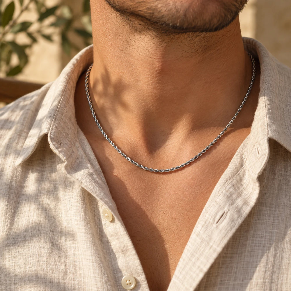 Silver-tone 3 mm rope chain necklace worn at the collarbone with an open linen shirt — true size: the rope chain is 3 mm thick
