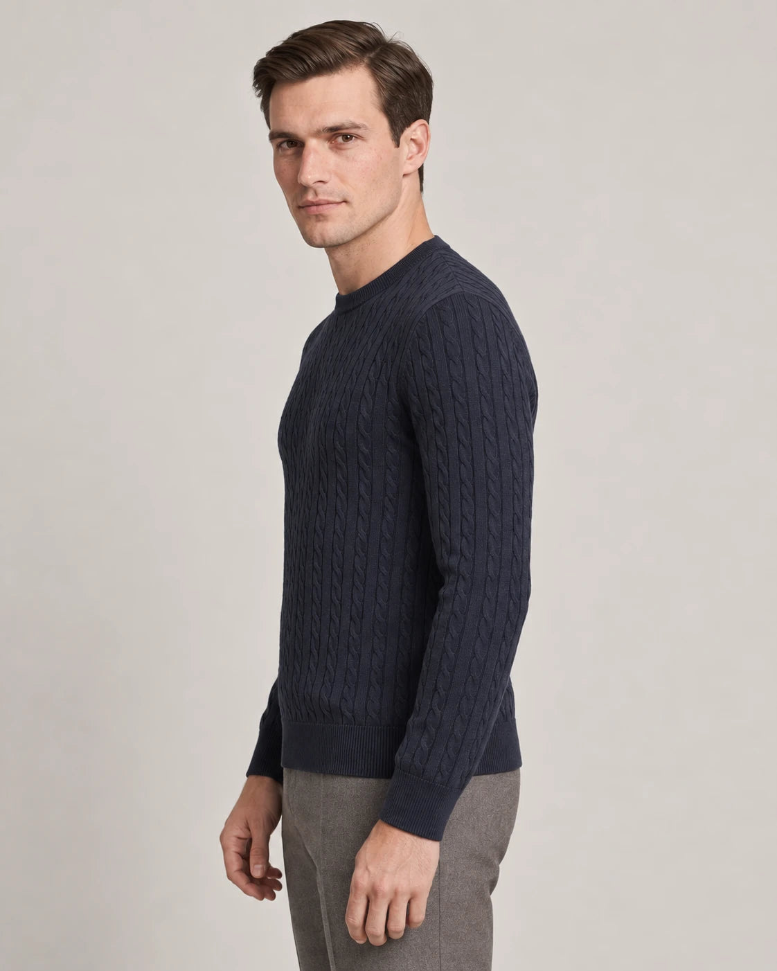 Man wearing the Kade navy cable-knit crew neck sweater, side view - Model Side View
